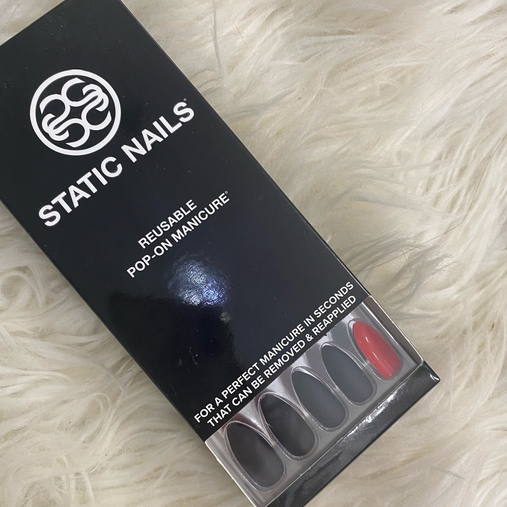 Static Nails never opened in black with red back.